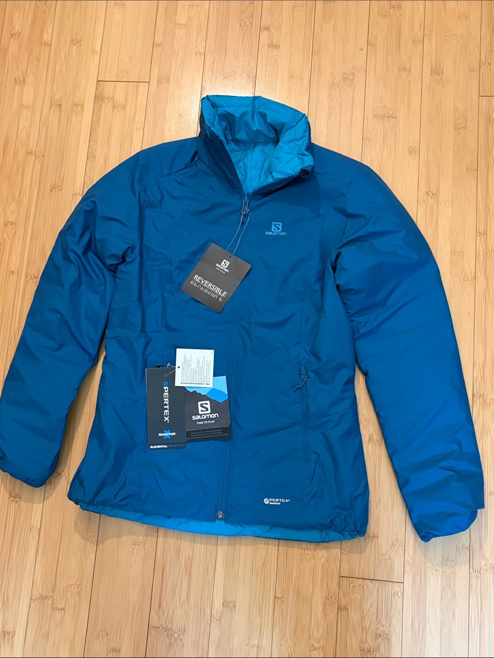 Salomon Women's Reversible Puffer Jacket in Bright Teal Blue